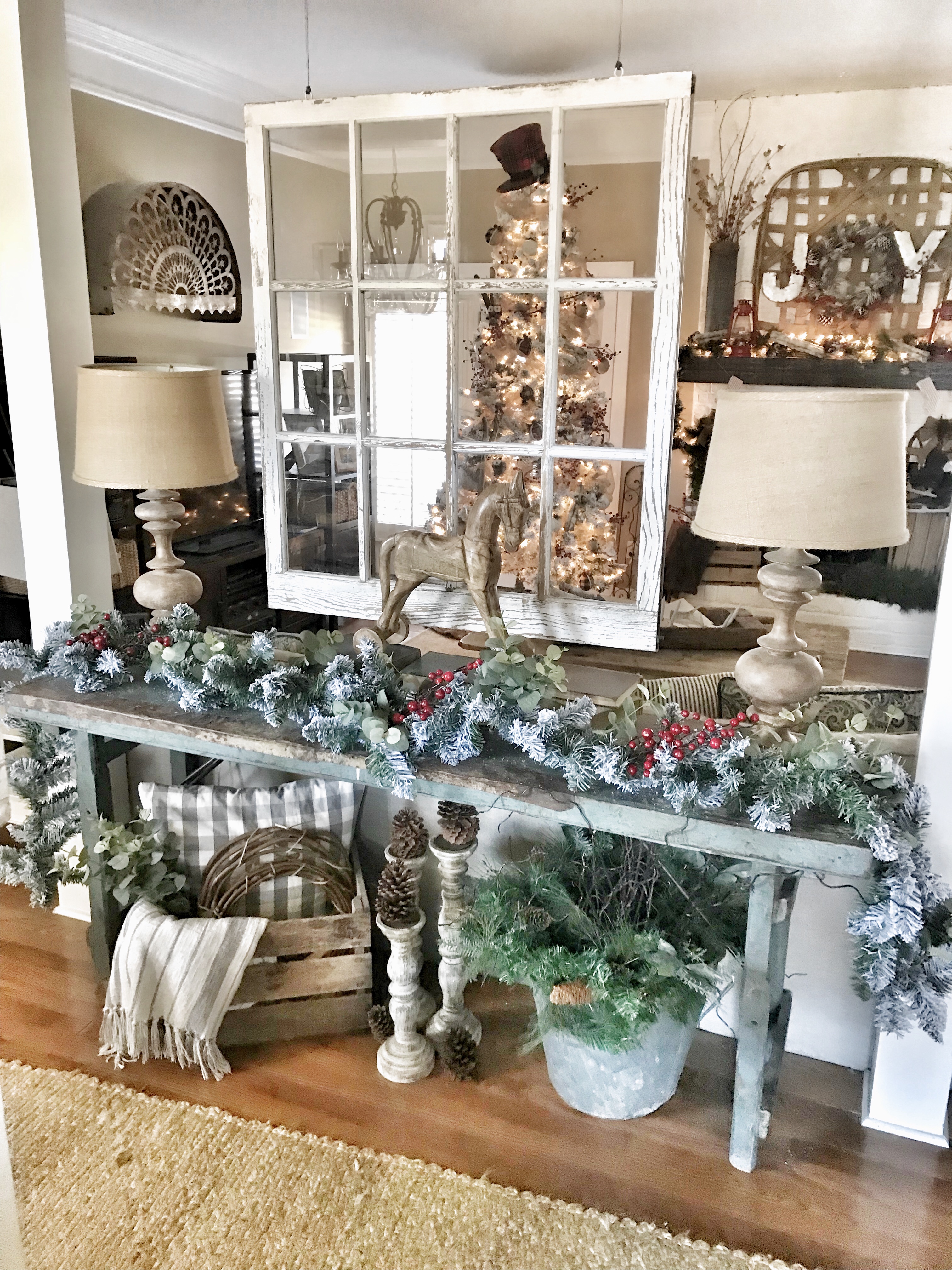 console table with flocked garland and Christmas decor