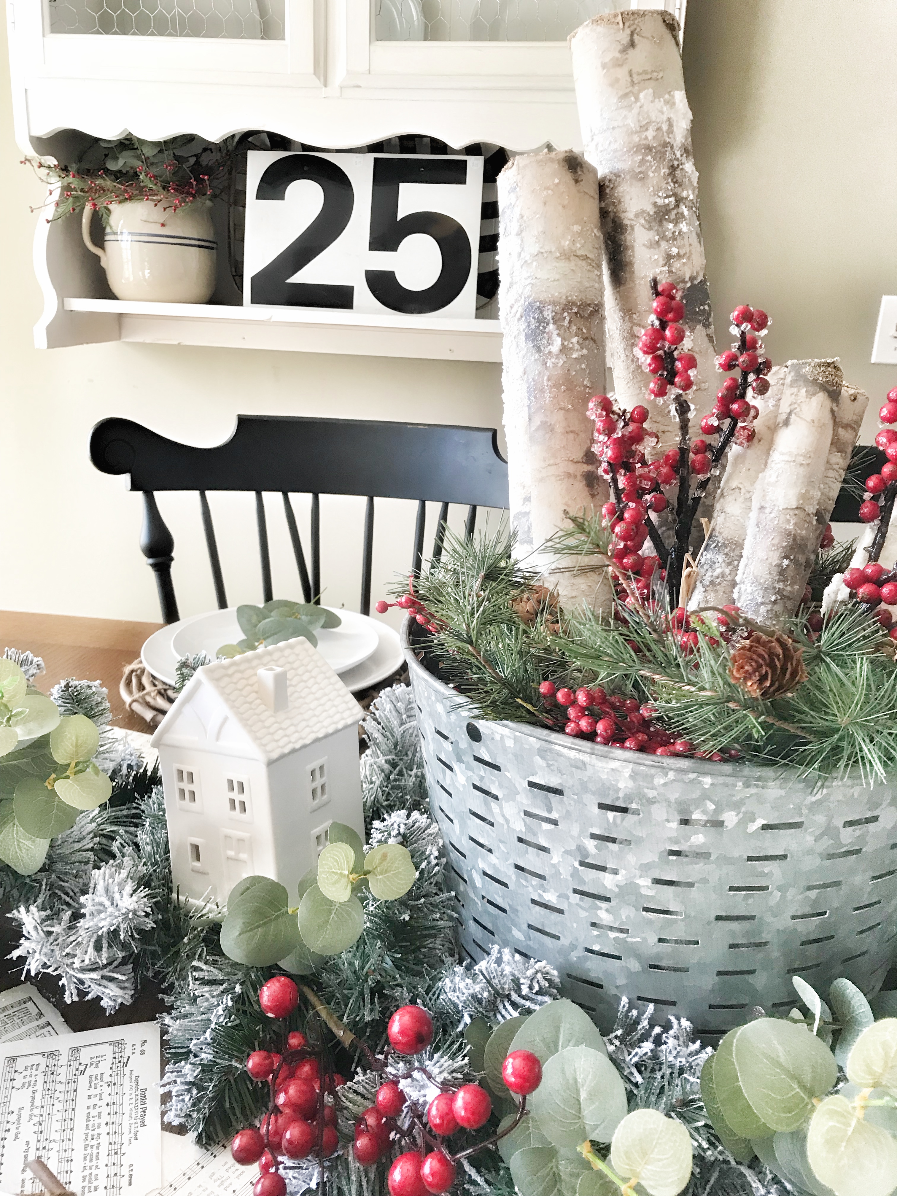 Christmas table decor with white cottages and garland