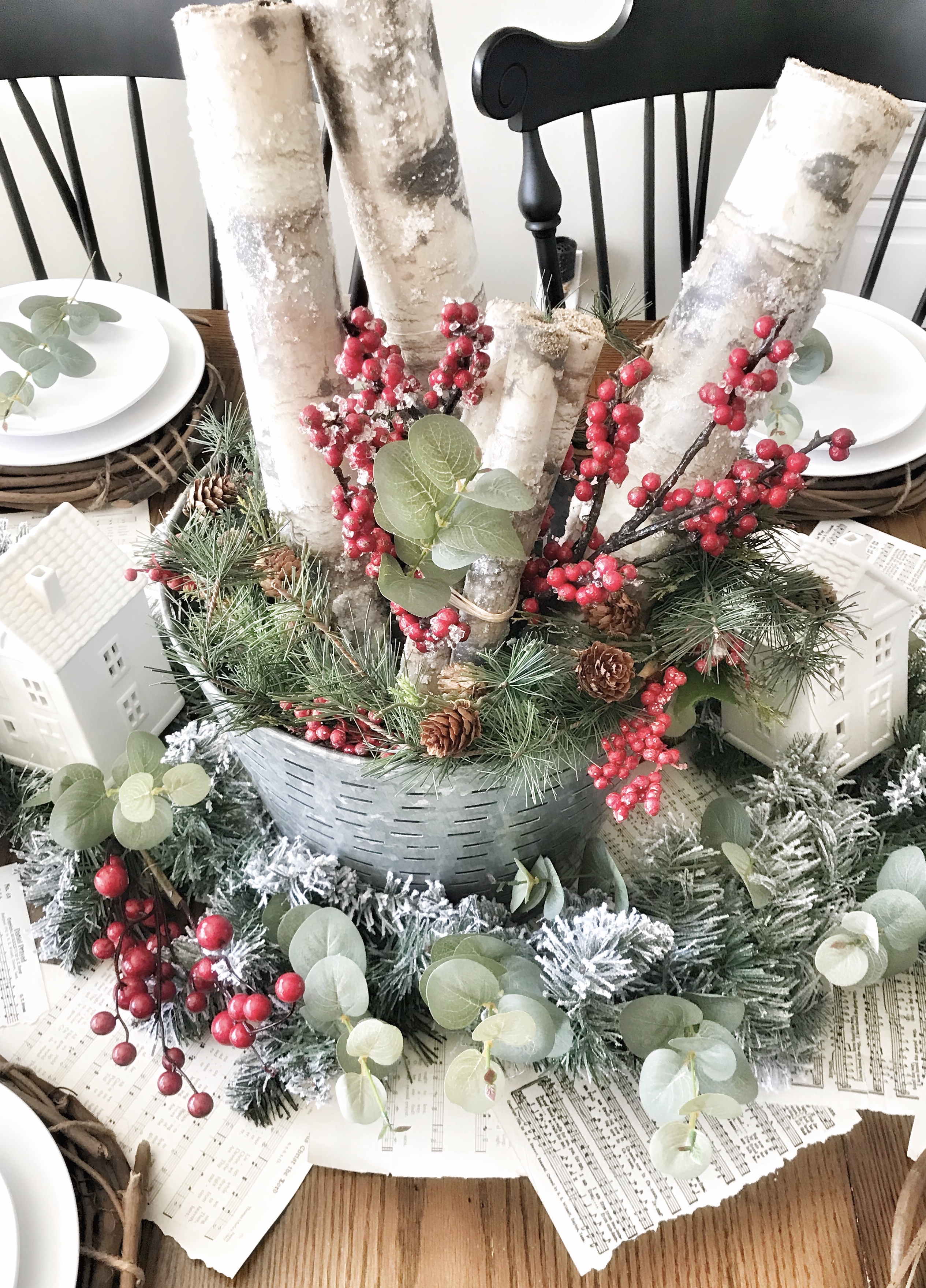 Christmas table centerpiece with wood and greenery 