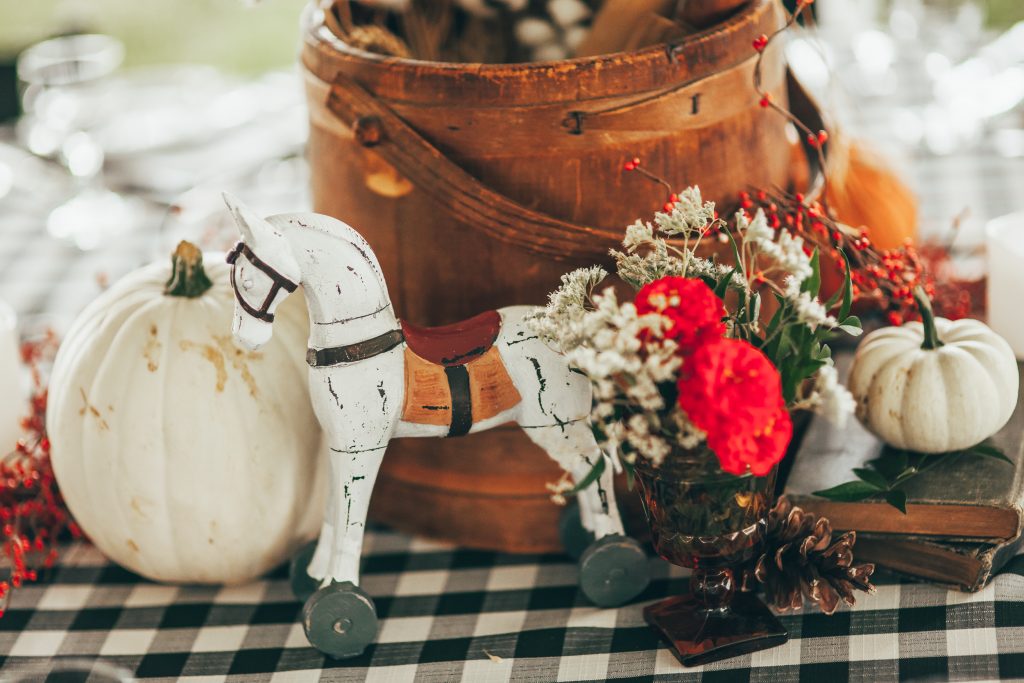 close up of small white wooden horse in centerpiece