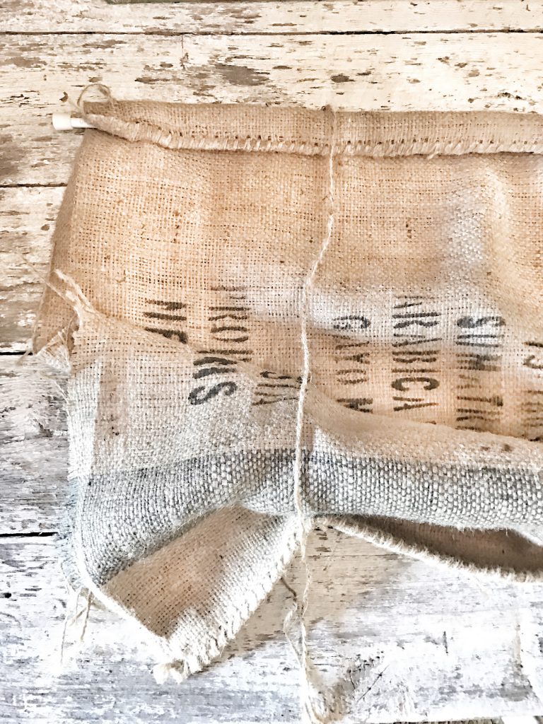 burlap sack with rod and twine