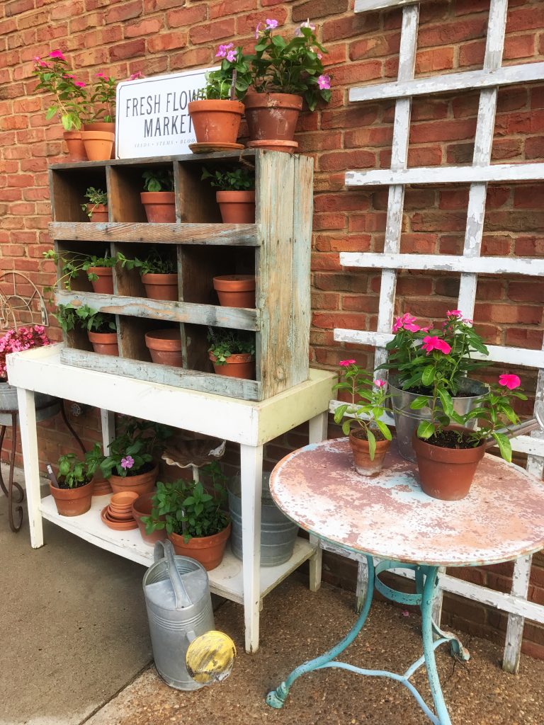 herb garden planter and antique table with flowers