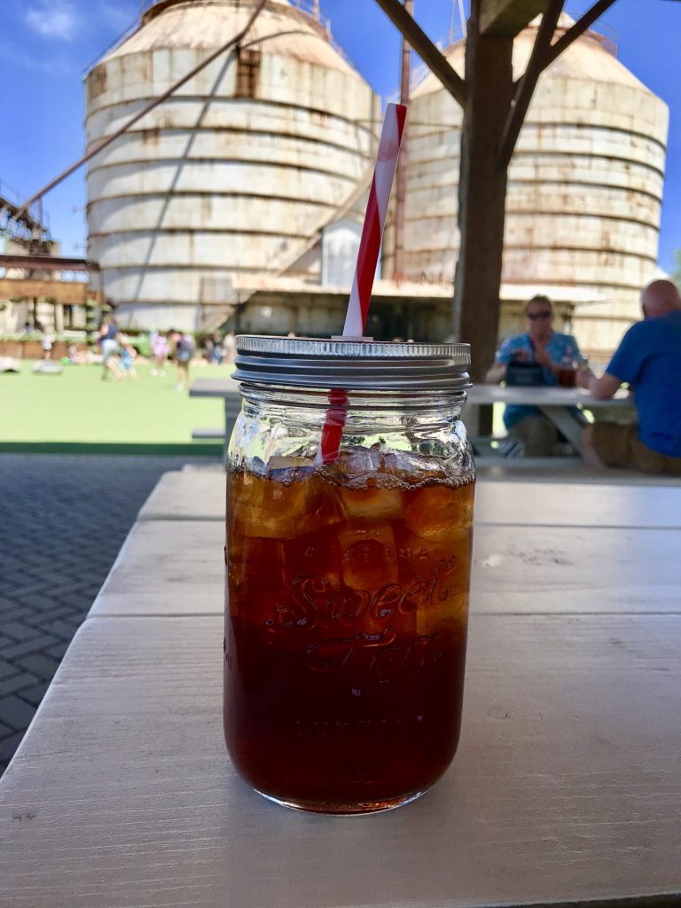 Sweet tea in foreground of Magnolia Silos