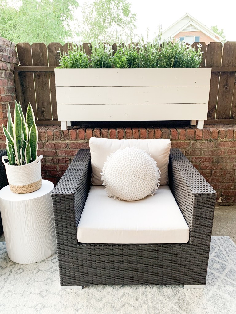 chair with side table and large planter box