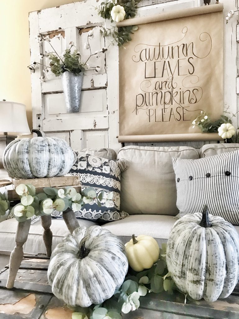 finished scroll sign in background of fall decor