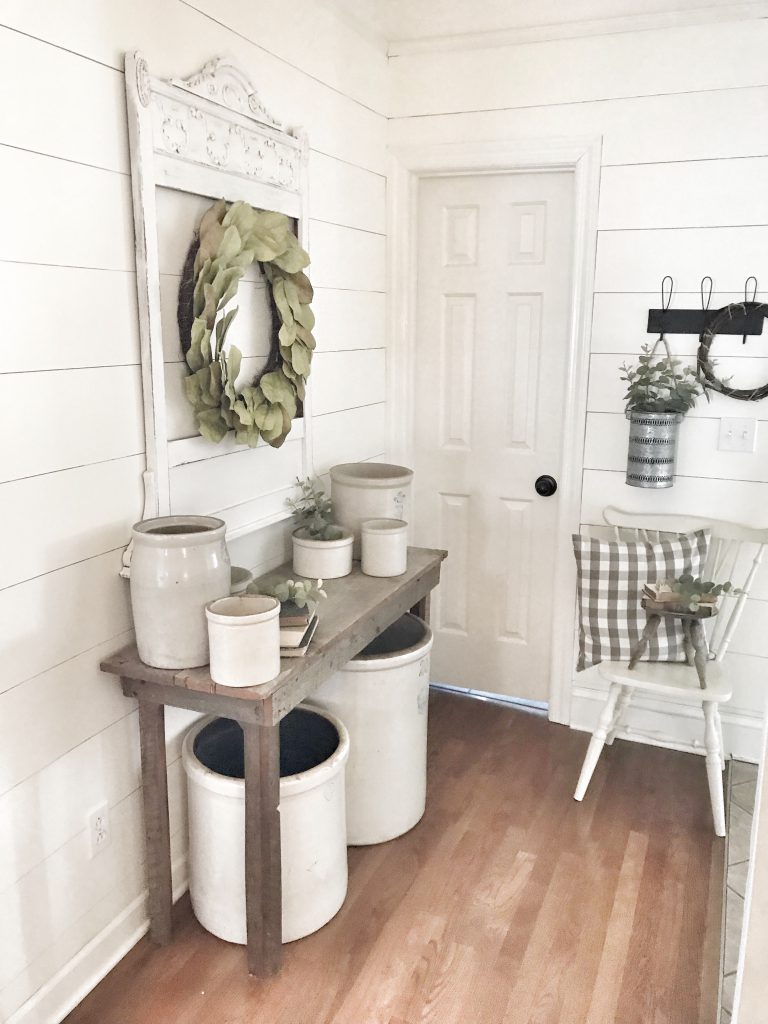 side view of farmhouse hallway with faux shiplap walls