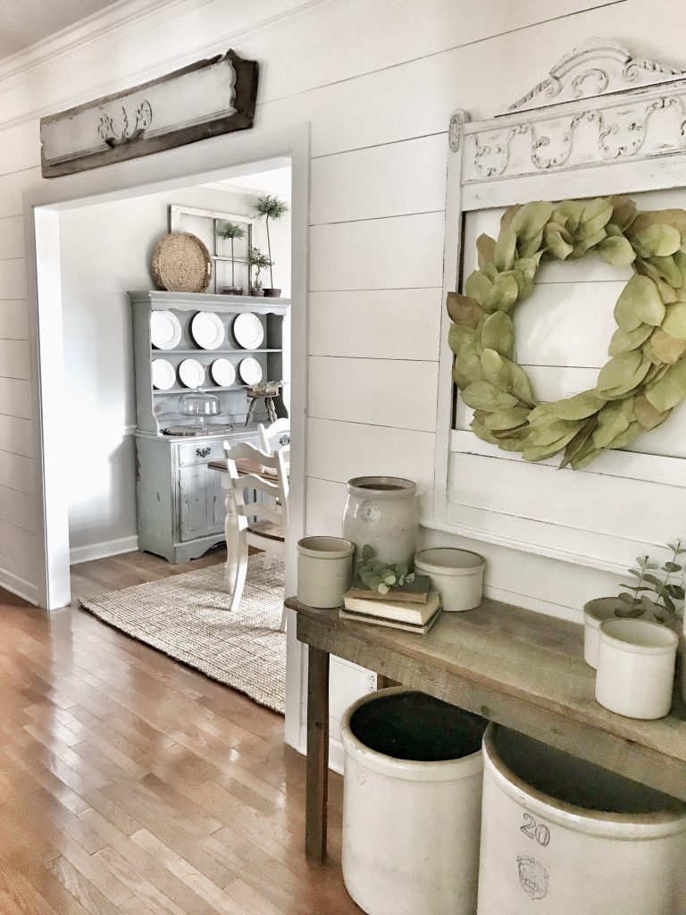 farmhouse hallway with planked white walls