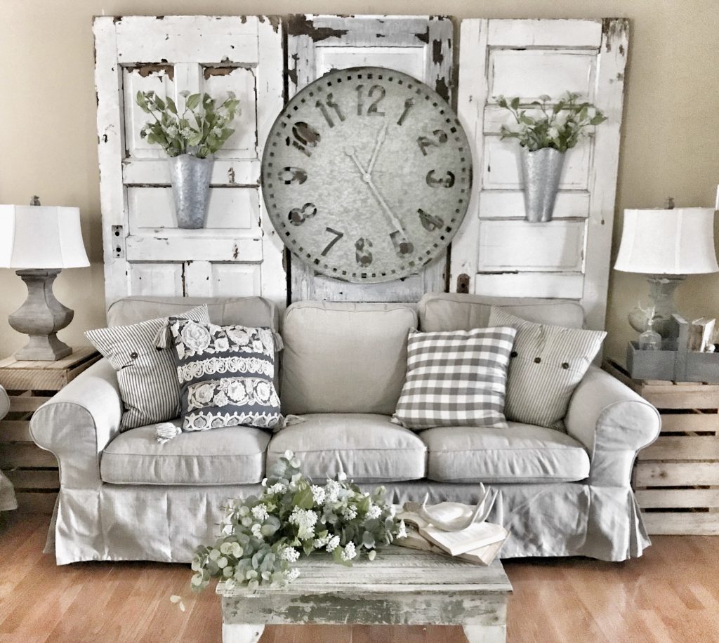 farmhouse wall clock hung in living room